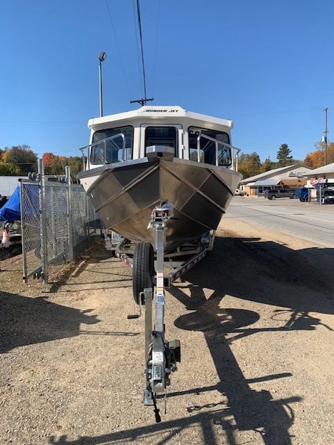 Front view of a boat on trailer at Camp and Cruise.