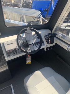 Boat helm console with steering wheel and controls for Thunder Jet 26 Alexis Pro XL.