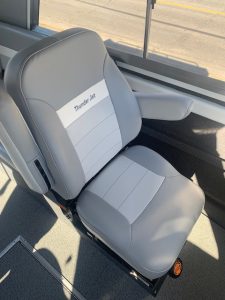 Comfortable bus seat with Thunder Jet branding for passenger comfort.