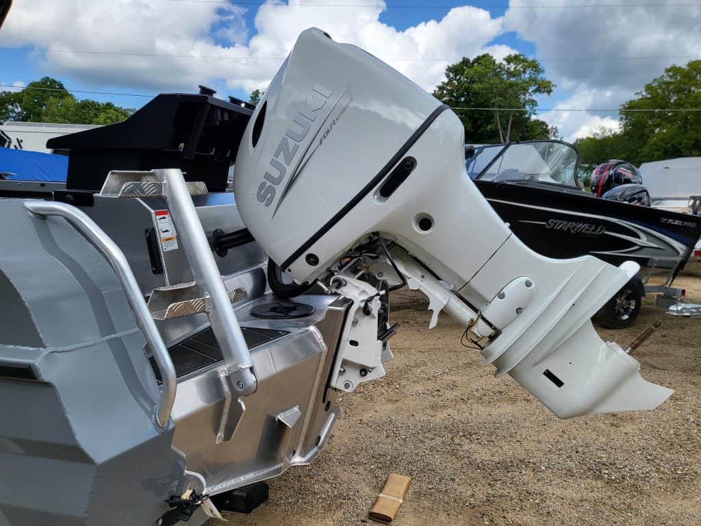Image of a Suzuki outboard motor on a boat at Camp & Cruise.