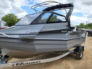 Outdoor fishing boat with modern design at Camp & Cruise, ideal for freshwater and saltwater fishing adventures.