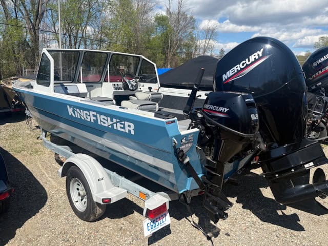 Blue KingFisher boat with Mercury outboard engines on trailer at Camp & Cruise.