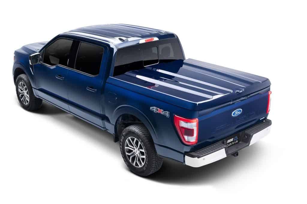 Blue Ford F-150 pickup truck with bed cover, 4x4 drive, and stylish features, perfect for versatile driving.