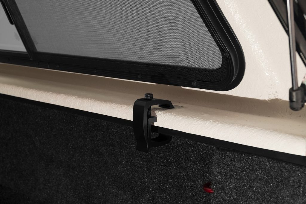 Close-up of a window screen clip at Camp & Cruise sporting venue.