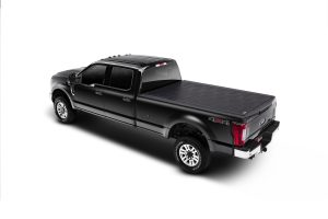 Black electric pickup truck with 4x4 capability and covered bed, modern design, and premium features.