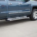 Side view of a Chevrolet Silverado with running boards at Camp & Cruise.