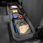 Organized vehicle storage with tools and supplies for roadside emergencies.