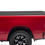 High-quality red pickup truck with rugged off-road tires at Camp & Cruise.