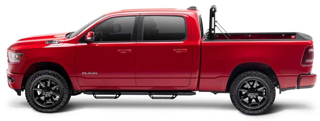 Red Ram pickup truck with rugged tires and spacious cargo bed, ideal for sports and utility use.