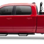 Red Ram pickup truck with rugged tires and spacious cargo bed, ideal for sports and utility use.