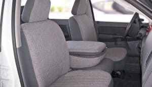 Interior view of a spacious vehicle with plush fabric seats, ideal for family and group travel.