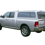 High-quality silver Ram 1500 truck with camper shell for outdoor adventures and cargo needs.