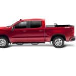 Red pickup truck with spacious cargo bed, ideal for sports gear and adventure trips.