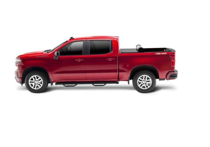 Red pickup truck with spacious cargo bed, ideal for sports gear and adventure trips.