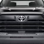 Close-up of a sleek black Toyota Tundra pickup truck front grille and headlights. Perfect for car enthusiasts and truck buyers.