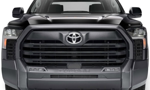 Close-up of a sleek black Toyota Tundra pickup truck front grille and headlights. Perfect for car enthusiasts and truck buyers.