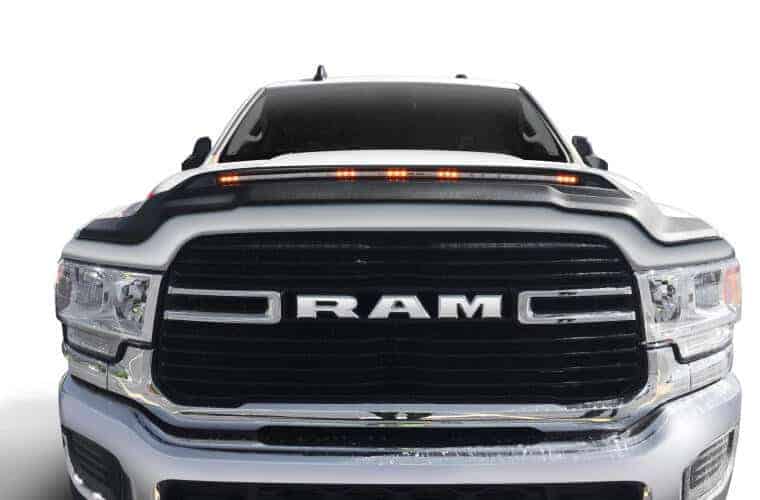 Ram truck with bold grille and headlights showcase durability and performance.