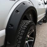 High-performance off-road tires on rugged pickup truck.