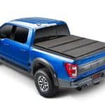 High-quality black truck bed cover for Ford F-150 at Camp & Cruise. Durable, weather-resistant, perfect for truck bed protection.