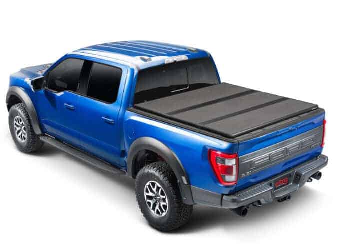 High-quality black truck bed cover for Ford F-150 at Camp & Cruise. Durable, weather-resistant, perfect for truck bed protection.