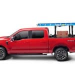 Heavy-duty work truck with ladder rack, tools, and equipment for construction and maintenance.