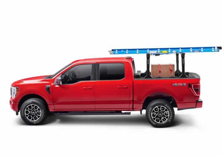 Heavy-duty work truck with ladder rack, tools, and equipment for construction and maintenance.