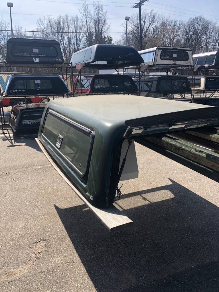 Truck bed topper for vehicles, shown at Camp & Cruise, ideal for truck bed weather protection.