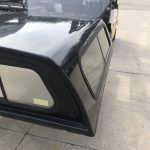 Weather-resistant truck bed cap for pickups, ideal for storage and protection.
