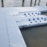 Floating dock and pontoon system for water sports, marine access, and boat mooring. Durable, customizable boat dock solutions.
