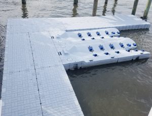 Floating dock and pontoon system for water sports, marine access, and boat mooring. Durable, customizable boat dock solutions.