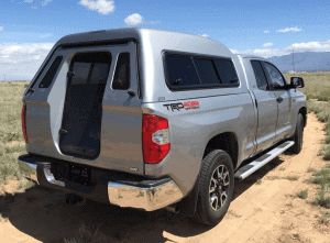 High-quality off-road truck with Camper canopy for outdoor use.