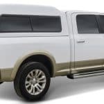 Durable white and bronze Ram pickup truck for outdoor sports and active lifestyles.