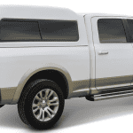 Durable white and bronze Ram pickup truck for outdoor sports and active lifestyles.