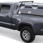 Enhanced truck bed storage system with roof racks and organizers for Toyota Tacoma vehicles.