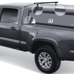 Enhanced truck bed storage system with roof racks and organizers for Toyota Tacoma vehicles.