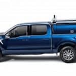 Blue utility truck with equipment rack for sports services.