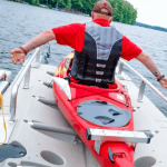 Enjoy kayaking at Camp & Cruise with scenic lake views and water sports activities.