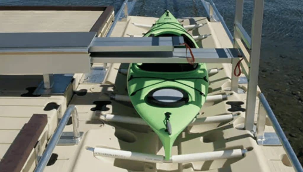 Bright green kayak secured on boat dock at Camp & Cruise.