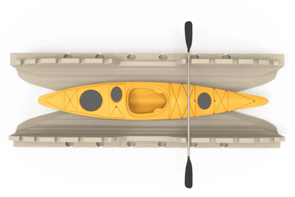 Bright yellow kayak with paddle inside storage racks at Camp & Cruise.