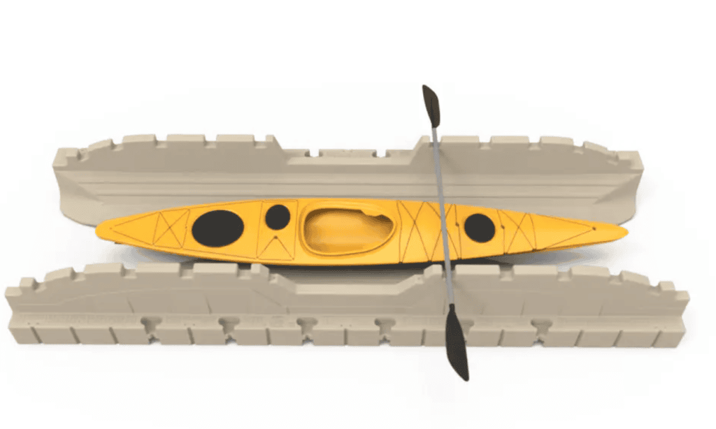 Bright yellow kayak with paddles in foam storage box. Perfect for outdoor water sports, aquatic adventure, and kayaking activities.