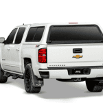 White Chevrolet Silverado pickup truck with sporty tires, tinted windows, and Chevrolet emblem.