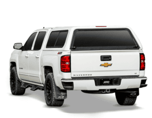 White Chevrolet Silverado pickup truck with sporty tires, tinted windows, and Chevrolet emblem.