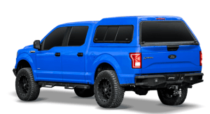 High-resolution image of a customized Ford F-150 pickup truck in bold blue color with off-road tires.