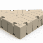 Durable beige modular tile for sports court flooring and gym surfaces.
