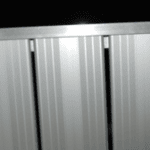 Close-up of metal siding at Camp & Cruise, enhancing sports facility's modern look.