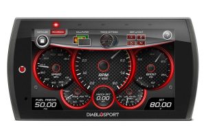 High-tech racing dashboard display with speed, RPM, boost pressure, and fuel pressure gauges.