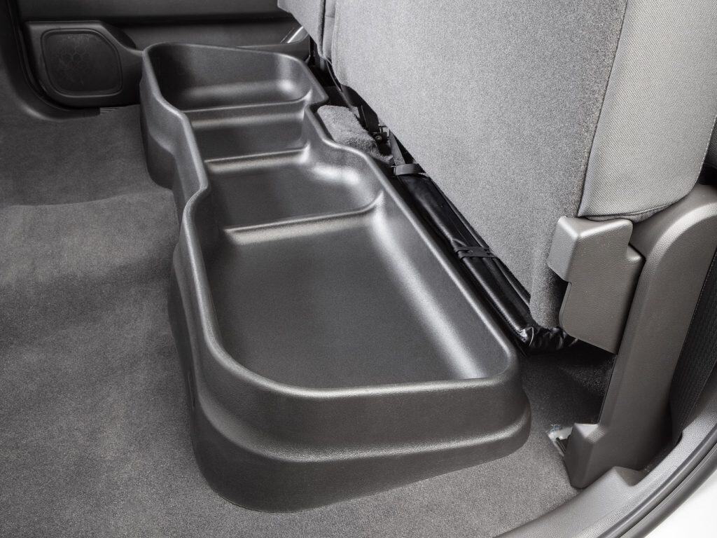 Back seat fold-out storage tray for convenient organization and easy access in vehicles.