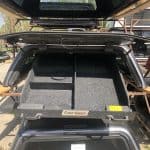 Durable roof cargo box for sports gear storage, ideal for outdoor sports trips at Camp & Cruise.