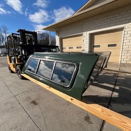 Green truck cap for Tundra 14-21 models with window and aerodynamic design.