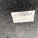 Close-up of Nissan Titan bed accessory label with serial and part info.
